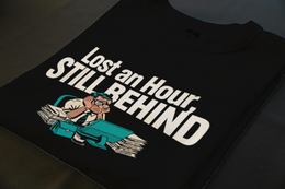 Folded T-Shirt mockup - Lost an Hour, Still Behind Schedule (CG3930) [dynamic_lifestyle]