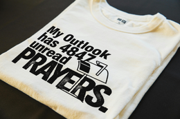 Folded T-Shirt mockup - My Outlook has 4847 unread prayers. (CG3913) [dynamic_lifestyle]