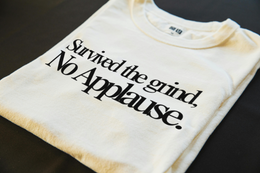 Folded T-Shirt mockup - Survived The Grind, No Applause (CG5655) [dynamic_lifestyle]