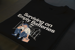 Folded T-Shirt mockup - Surviving On Empty Batteries (CG5898) [dynamic_lifestyle]